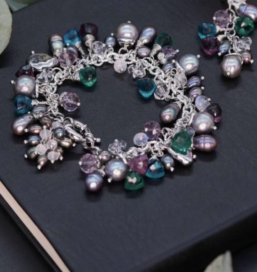 Midnight Garden charm bracelet with teal, violet and iridescent beads